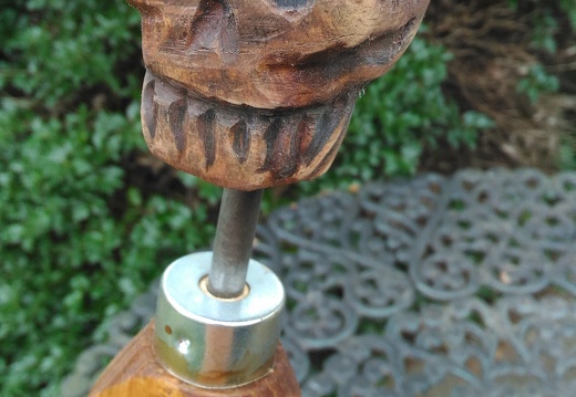 Carved wooden skull finial 